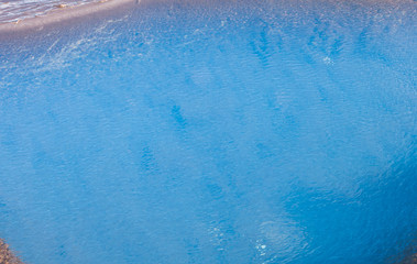 Surface of aquamarine water with small undulation - texture, image