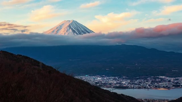 Timelapse of night clouds moving behind Mount Fuji at Kawaguchigo, Japan