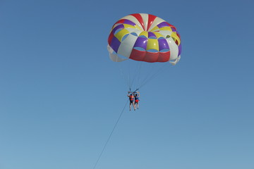 paragliding in the blue sky