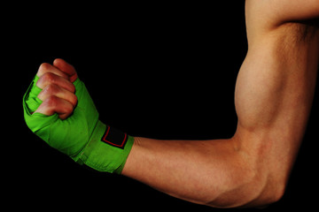 Male showing biceps with boxing straps