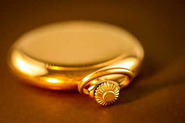 golden pocket watch closeup detail rotating wheel