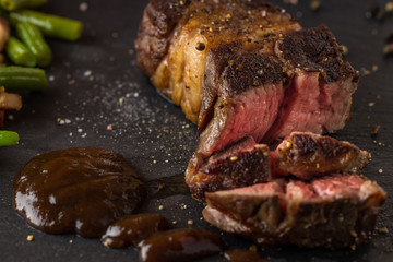 grilled steak from beef sirloin with green beans and bacon