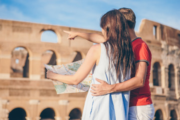 Fototapeta na wymiar Happy family in Europe. Romantic couple in Rome over Coliseum background