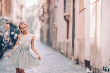 Adorable fashion little girl outdoors in European city Rome
