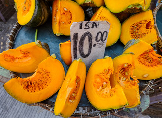 Slice of yellow pumpkin at rural market