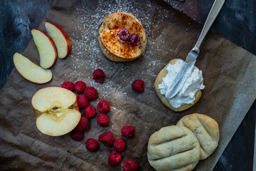Polish cuisine - crispy, baked bread with yogurt, cinnamon, chilli, apples and raspberries