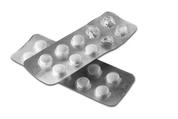 Two blisters with pills. One blister is already unpacked.