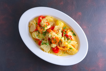 Shrimp stew with potato, paprika, carrot and onion