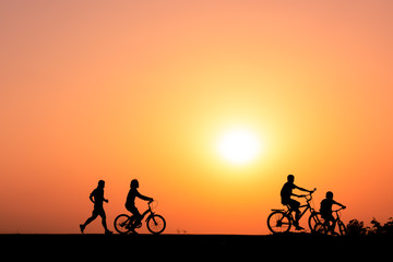ride a bicycle ,silhouette background.