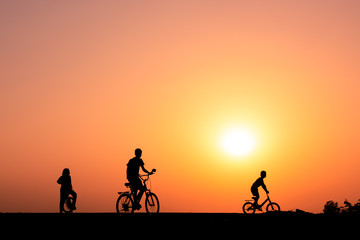 Fototapeta na wymiar ride a bicycle ,silhouette background.