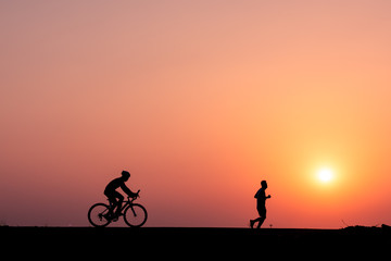 ride a bicycle ,silhouette background.