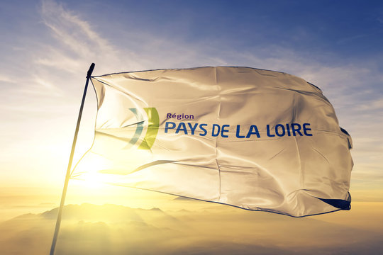 Pays de la Loire of France flag waving on the top sunrise mist fog