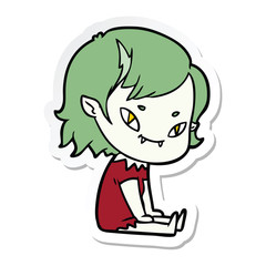 sticker of a cartoon friendly vampire girl sat down
