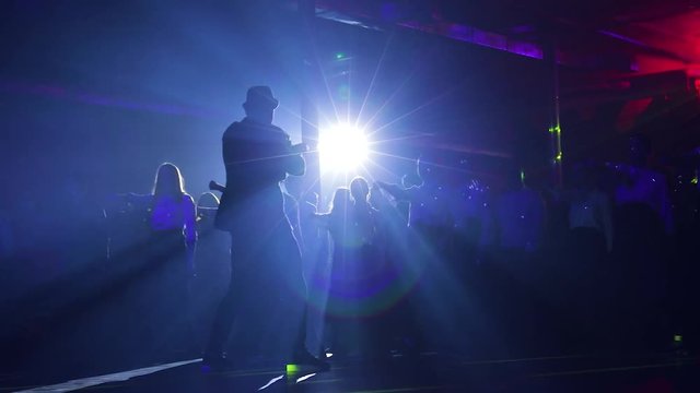 Leading, showman, works for the public. silhouette. dance master class