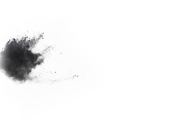 particles of charcoal on white background,abstract powder splatted on white background,Freeze motion of black powder exploding or throwing black powder.