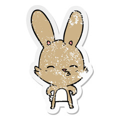 distressed sticker of a curious bunny cartoon