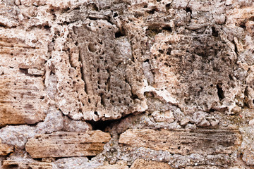 wall decoration with stones, light brown color; abstract background in light color