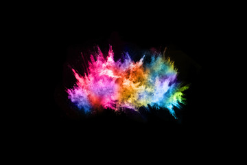 abstract colored dust explosion on a black background.abstract powder splatted background,Freeze motion of color powder exploding/throwing color powder, multicolored glitter texture.