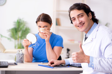 Fototapeta premium Woman visiting male doctor for plastic surgery 