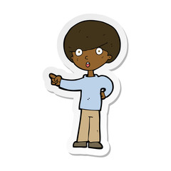 sticker of a cartoon pointing boy