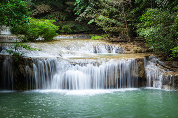 Fototapeta na wymiar Erawan Falls with emerald green ponds in Erawan National Park.