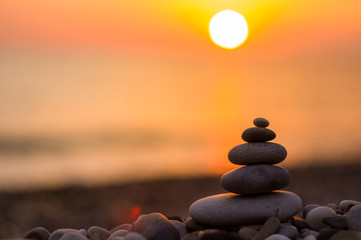 stack of zen stones on pebble beach