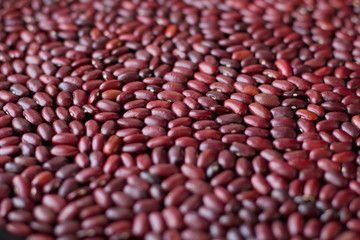 Red beans pattern as background. side view