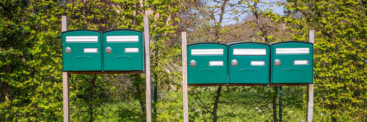 Range of mailboxes in the countryside, housing concept