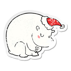 cute distressed sticker cartoon of a polar bear wearing santa hat