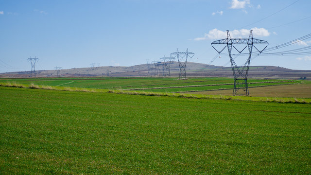 high-voltage electric poles in the field