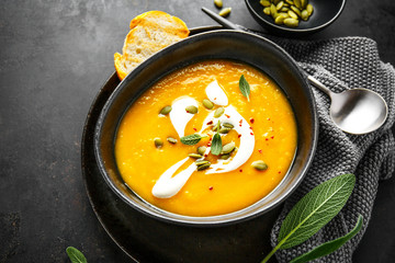 Pumpkin creamy soup served in bowl