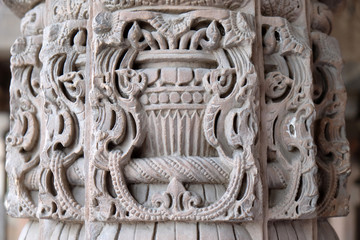 Columns with stone carving in courtyard of Quwwat-Ul-Islam mosque, Qutab Minar complex, Delhi, India 