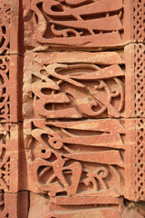 Stone carving on Qutab Minar, Delhi, India 
