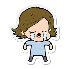 sticker of a cartoon girl crying