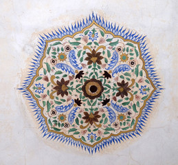 Beautiful ornament on wall of palace in Amber Fort in Jaipur, Rajasthan, India
