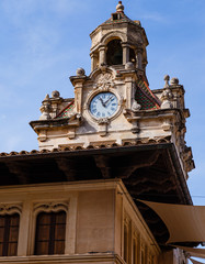tower of an old historic building with a dome under the dome; architectural ring tower with round white clock