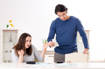 Fototapeta premium Young couple in budget planning concept 