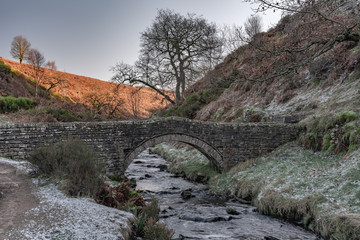 Fototapeta na wymiar A packhorse bridge at Goyt valley in the Peak District.