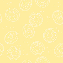 Soft, pastel yellow background with donuts. Vector seamless pattern with donuts. Cute sweet food baby background. Colorful design for textile, wallpaper, fabric, decor.
