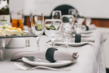 Empty glasses set in restaurant. Part of interior
