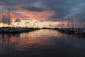 Colorful sunrise after a rainstorm over Dinner Key Marina in Coconut Grove, Miami, Florida.