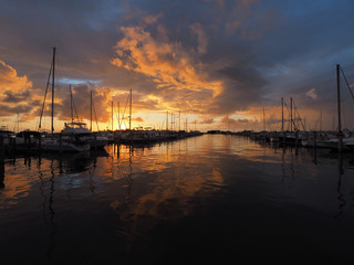 Colorful sunrise after a rainstorm over Dinner Key Marina in Coconut Grove, Miami, Florida.