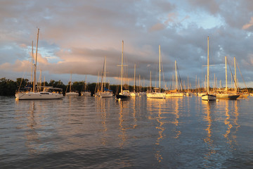 Fototapeta premium Early light after a rainstorm on the anchorage at Dinner Key Marina in Coconut Grove, Miami, Florida.