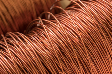 Close up of the bare bright copper wire on the spool.