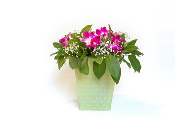 A large beautiful bouquet of pink and white flowers is in a green box on a white background.