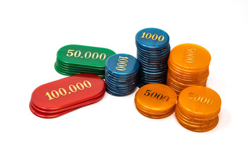 Stack of chips, isolated on white background. Colors: orange, blue, green, red. Betting, winning and losing at gambling. Play poker with fiches.