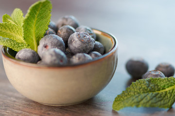 blueberries in a ceramic bowl, macro color photo