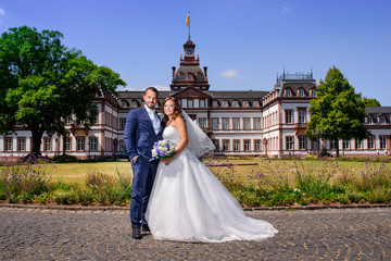 bride couple at the palace in the summer