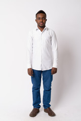 Fototapeta premium Full body shot of young African businessman standing