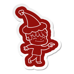 cartoon icon of a happy boy wearing santa hat